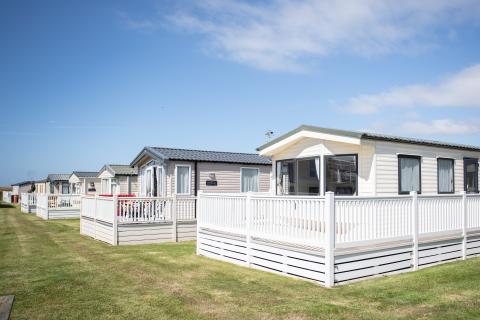 Privately owned caravans on the inner ring of the main field at Surf Bay Holiday Park
