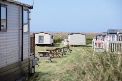 View down through Surf Bay Holiday Park toward the Country Park