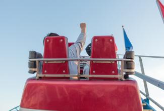 People enjoying a day out on a rollacoaster