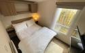 master double bedroom in the 2016 Swift Loire 28x12